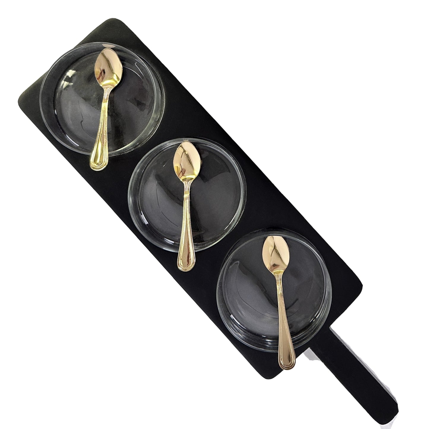 Three black plates with gold spoons on a black tray