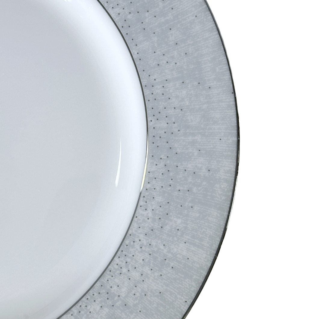 Round white porcelain plate with gray rim