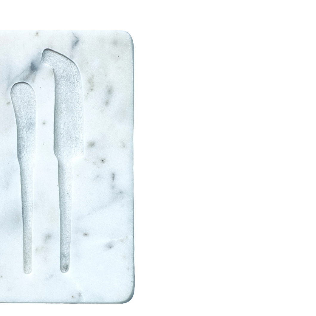 Marble cutting board with knife and fork on a white background