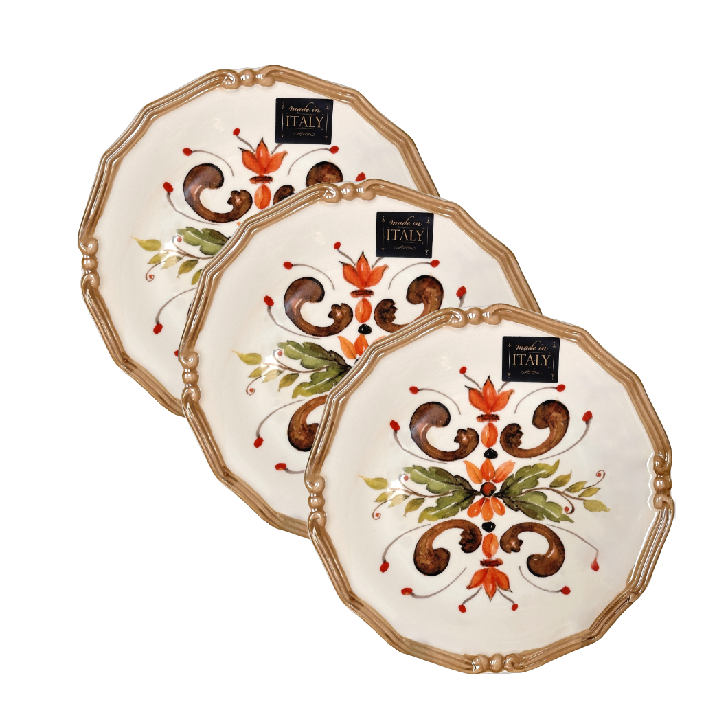 Three decorative plates with floral patterns on a white background