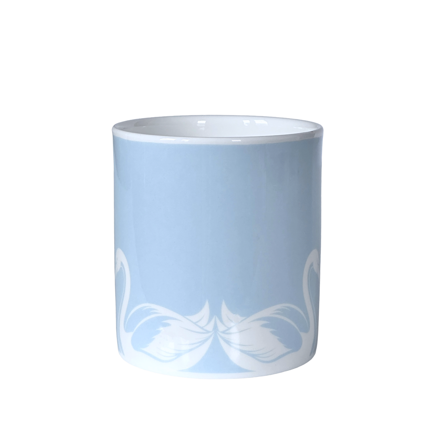 A light blue coffee mug by Roy Kirkham with white swan designs on a white background