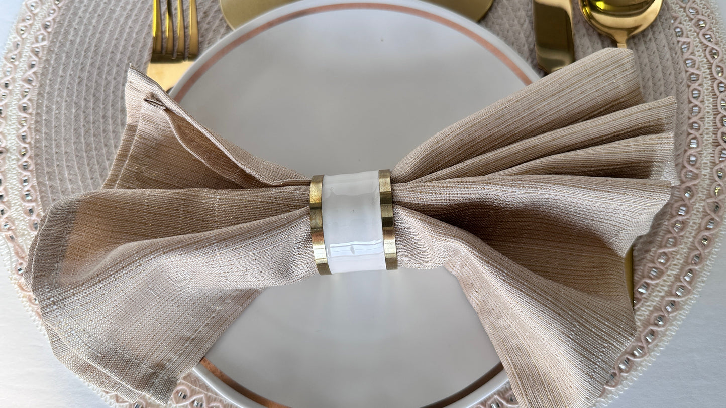 white napkin ring with gold rim