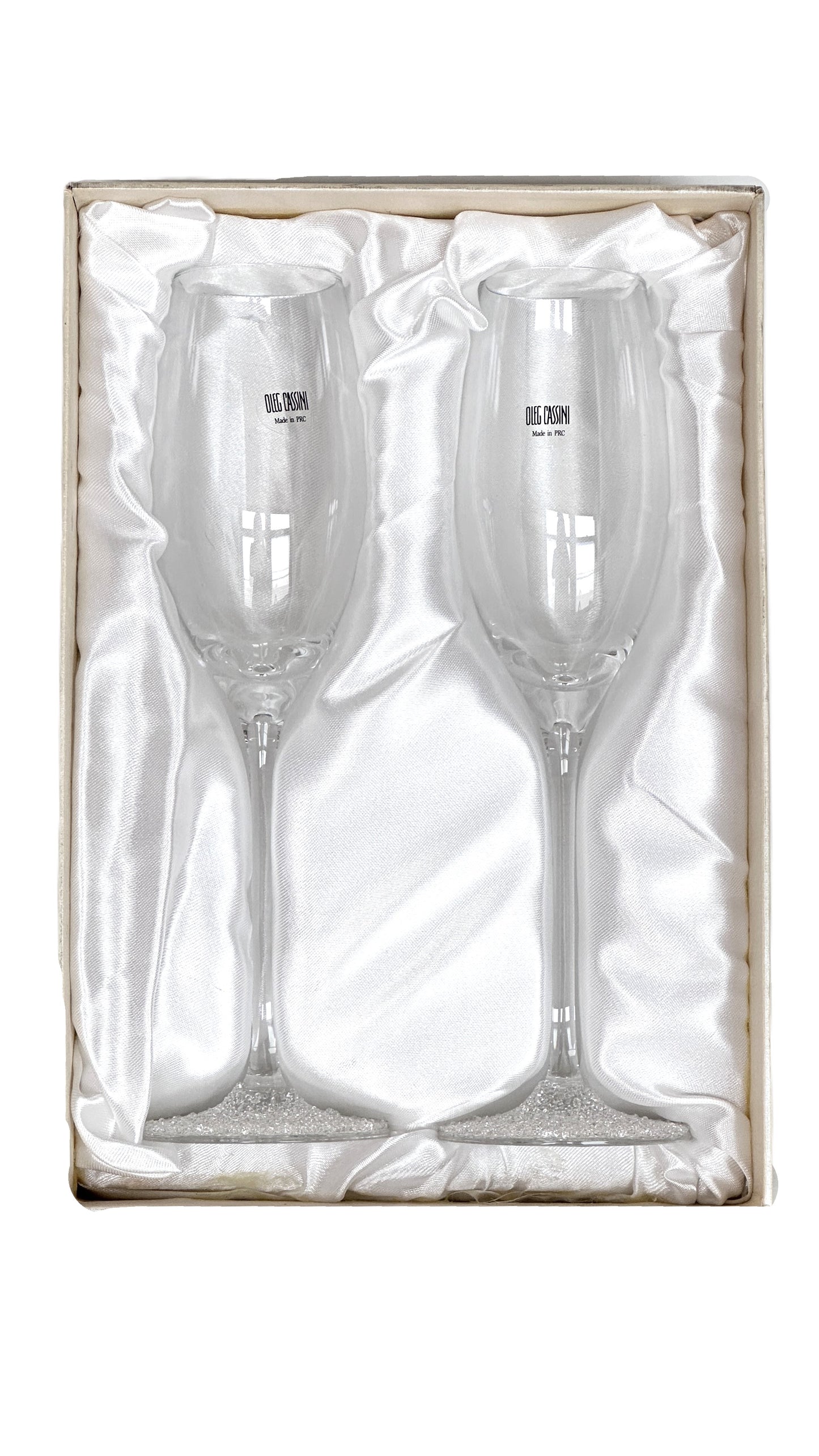 Two champagne flutes in a decorative box