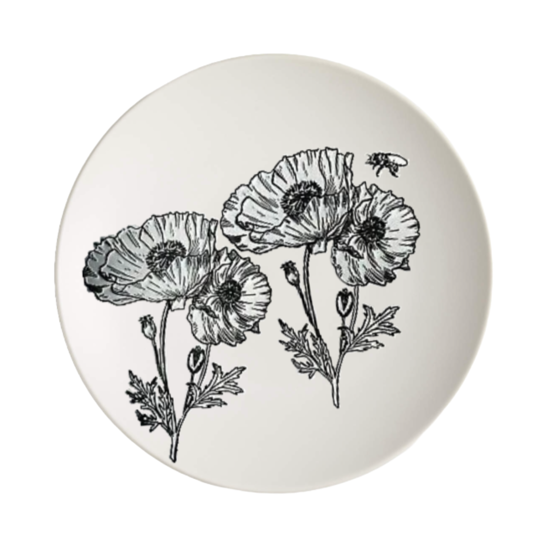 Round white plate with black floral illustrations