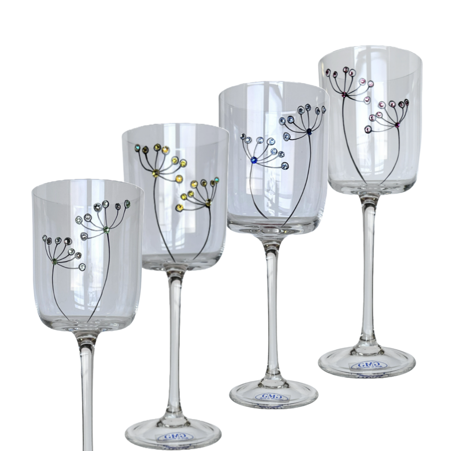 Set of four decorative wine glasses with floral designs on a white background