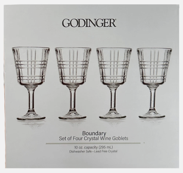 Godinger crystal wine goblets set on a gray background