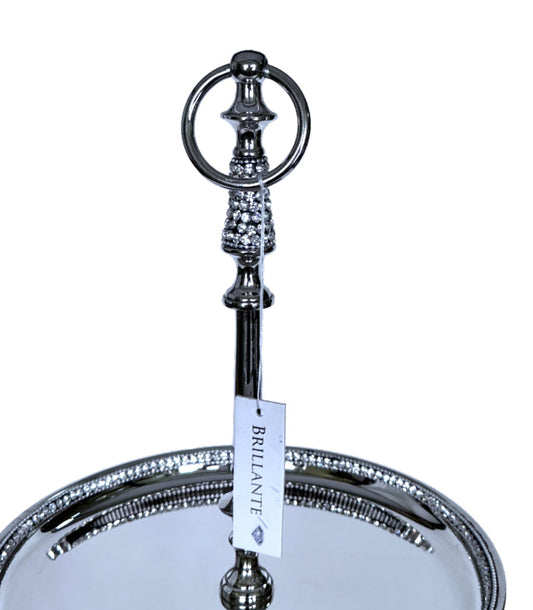 Decorative metal stand with a round base and circular top on a white background