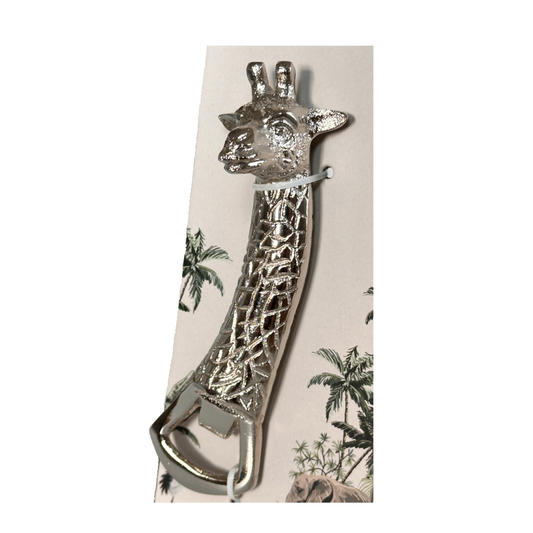 Giraffe-shaped bottle opener on packaging with palm trees and elephant design