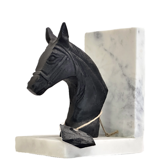 Black horse head sculpture on a marble base