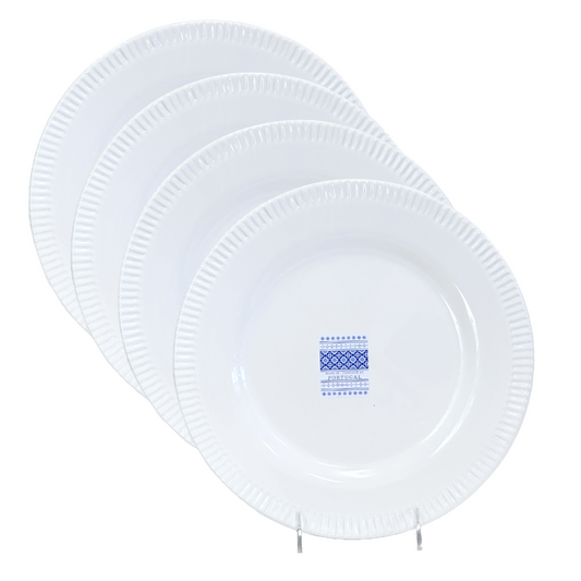 A set of four white ceramic plates with a keyboard rim