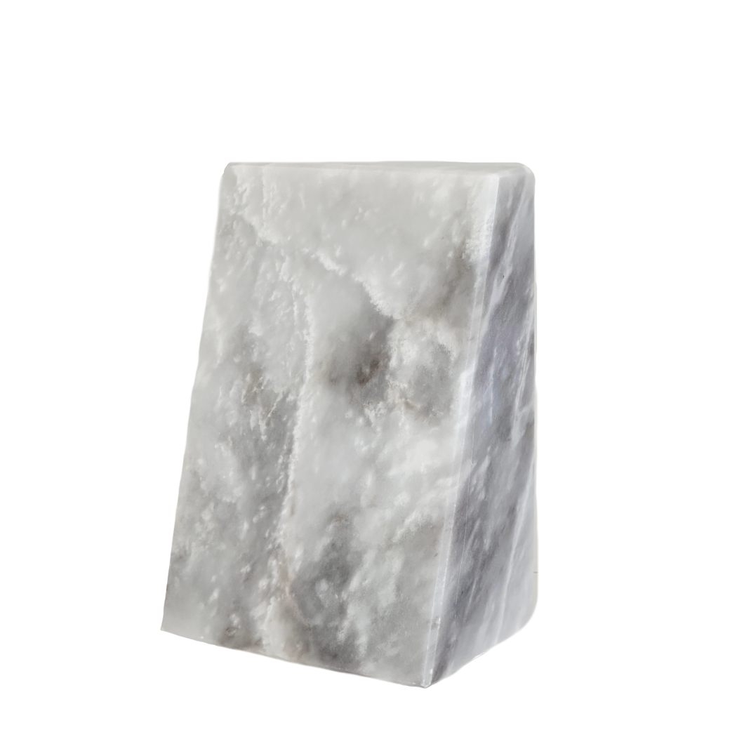 Two marble bookends on a white background