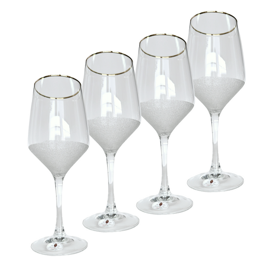 Set of five wine glasses with gold rims on a white background