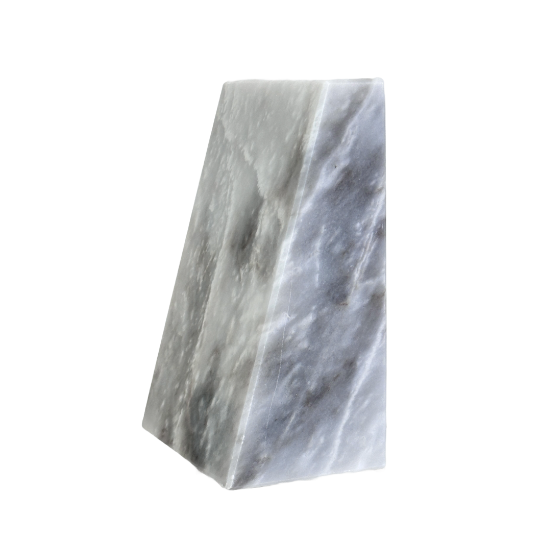 Two marble bookends on a white background