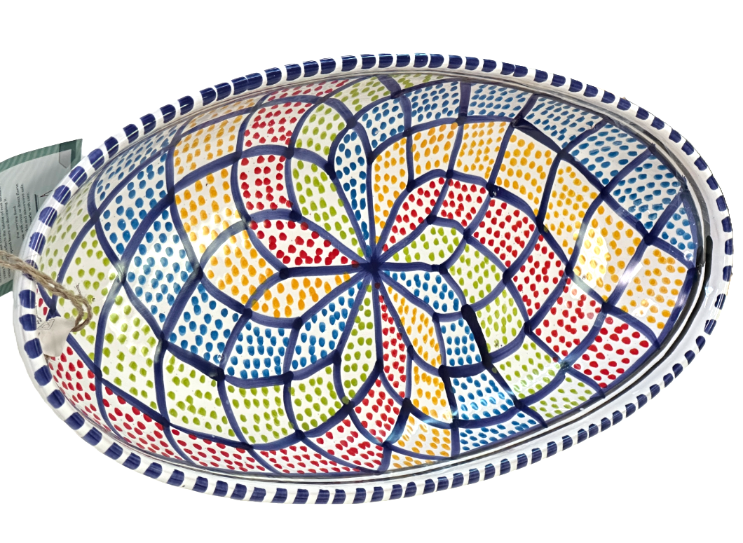 Decorative ceramic bowl with colorful geometric pattern on a white background