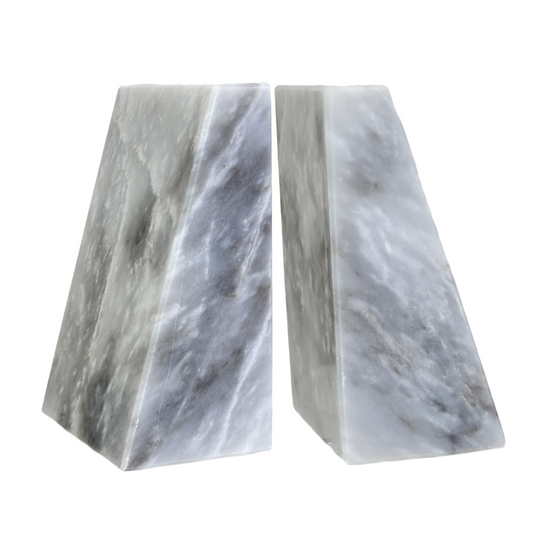 Two marble bookends on a white background