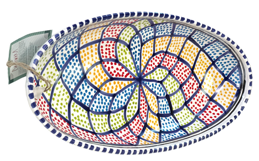 Colorful ceramic plate with geometric pattern on a white background