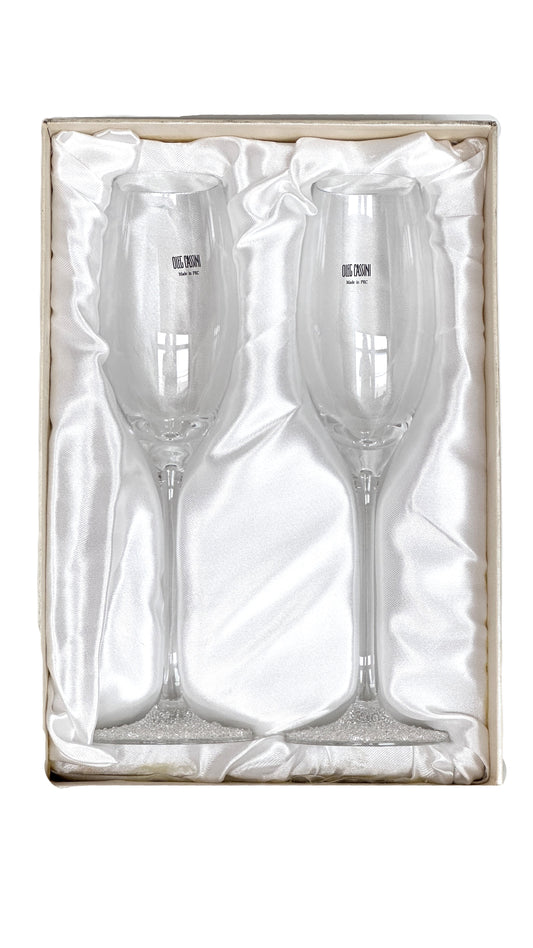 Two champagne flutes in a decorative box 