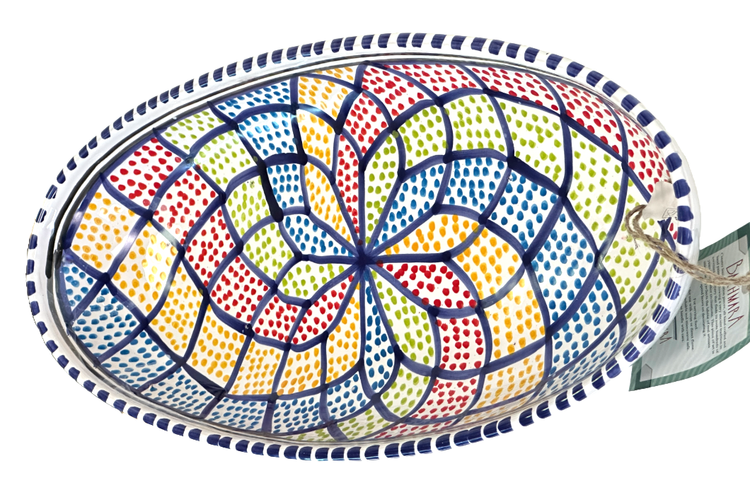 Colorful mosaic-patterned dish with a decorative border on a white background