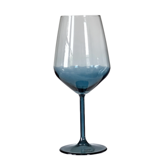 Clear wine glass with blue tint on a white background