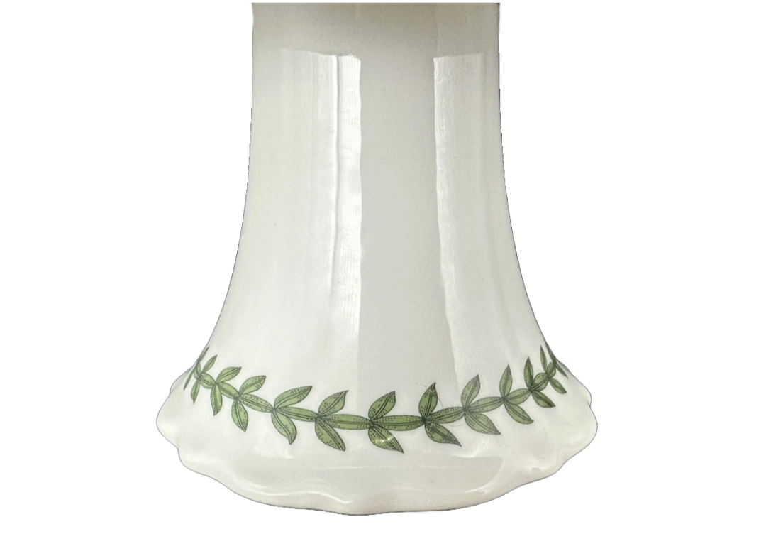 Yellow ceramic cake holder with green leaf pattern 