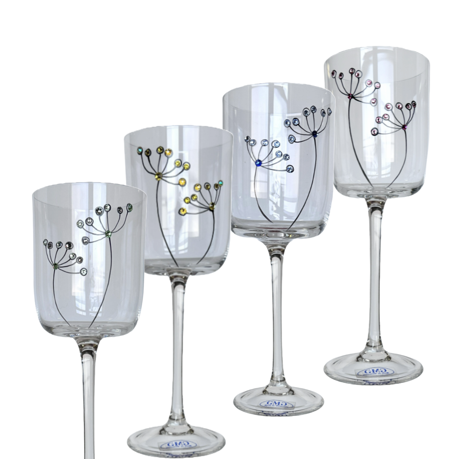 Set of four decorative wine glasses with floral designs on a white background