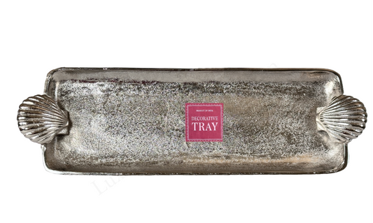 Decorative tray with shell designs on a white background