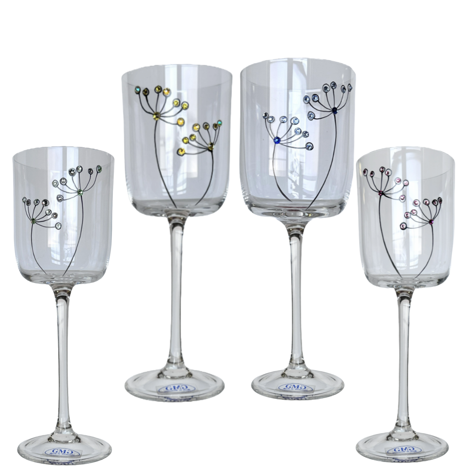 Set of four clear wine glasses with decorative designs on a white background