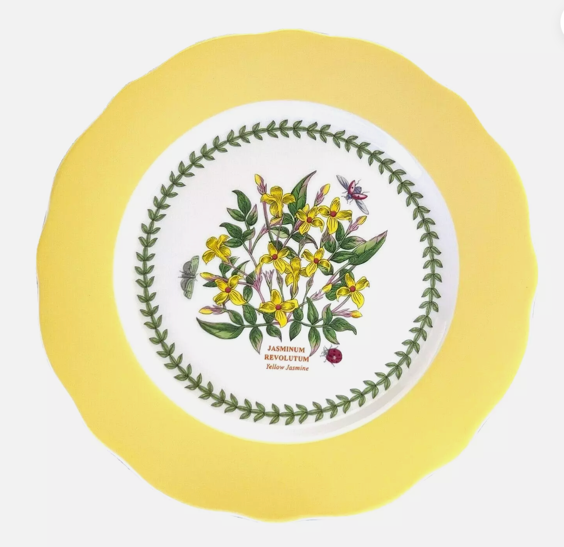 Yellow ceramic cake holder with green leaf pattern 