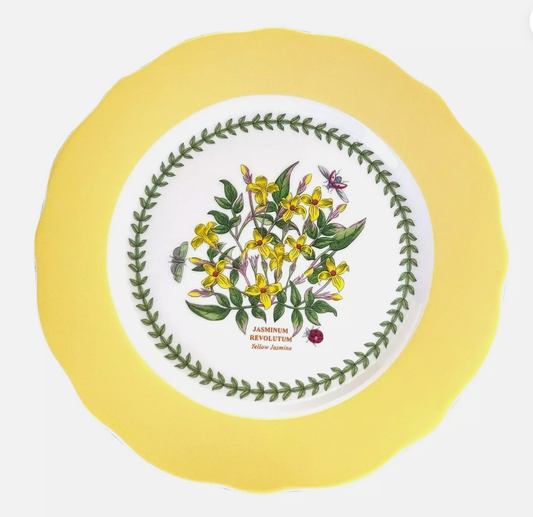 Yellow ceramic cake holder with green leaf pattern 