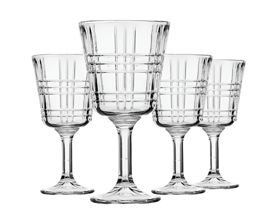 Set of four clear glass goblets with grid pattern on a white background